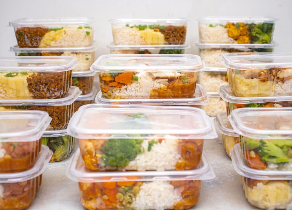 Healthy Meal Prep Ideas arranged in containers with grains, vegetables, and lean proteins on a clean kitchen counter
