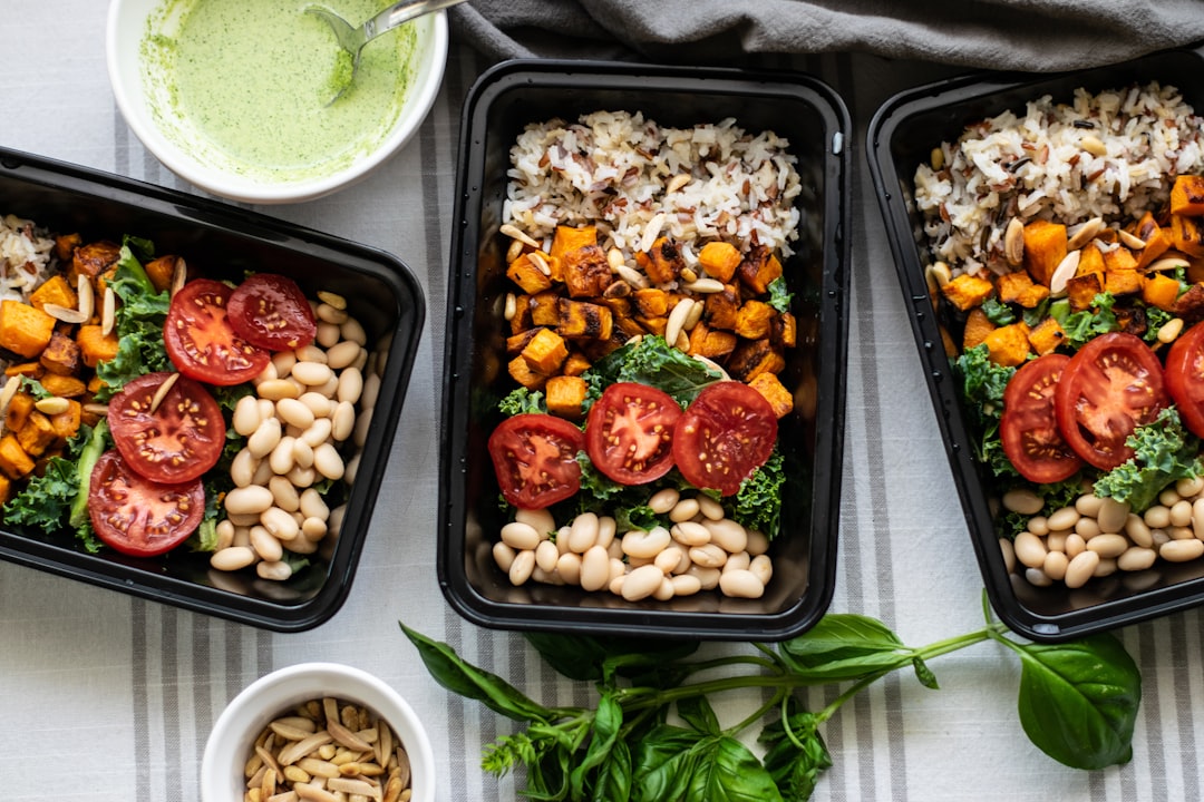 gluten-free meal prep containers with rice bowls, roasted vegetables, and labeled sauces